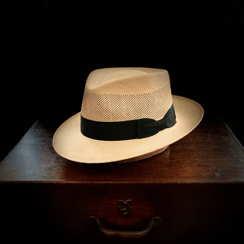 Natural straw, open weave golf style finely woven classic panama hat with black grosgrain bow band